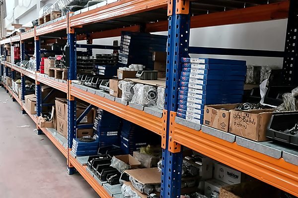 Spare parts warehouse shelving stocked with boxes